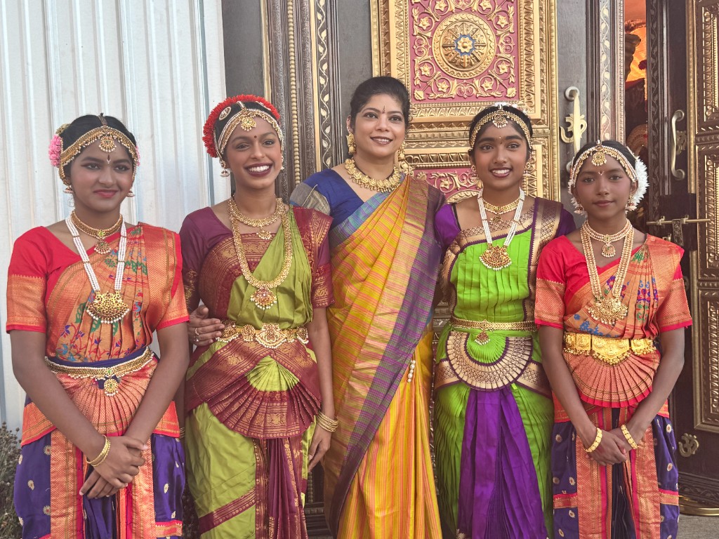 Dancers gathered at a temple doorway